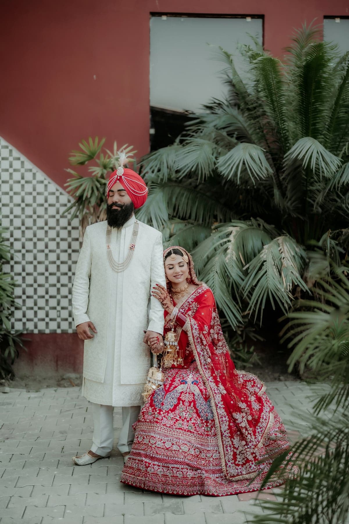A candid smile shared between the couple outdoors